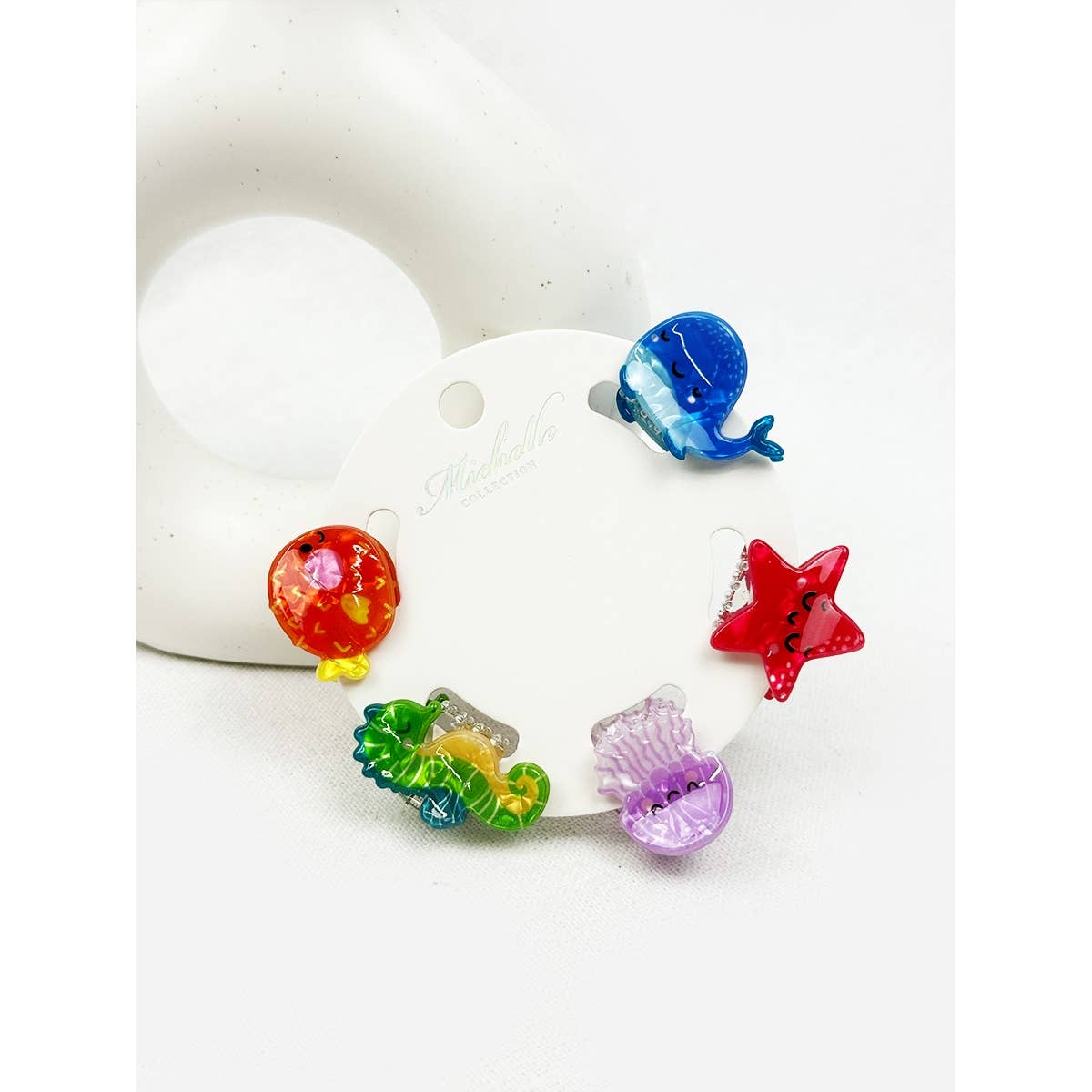 Colorful sea animal hair clips on a white background