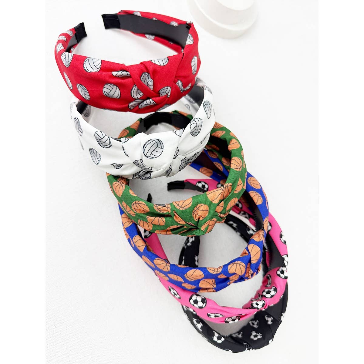 Set of colorful sports headbands with various patterns on a white background