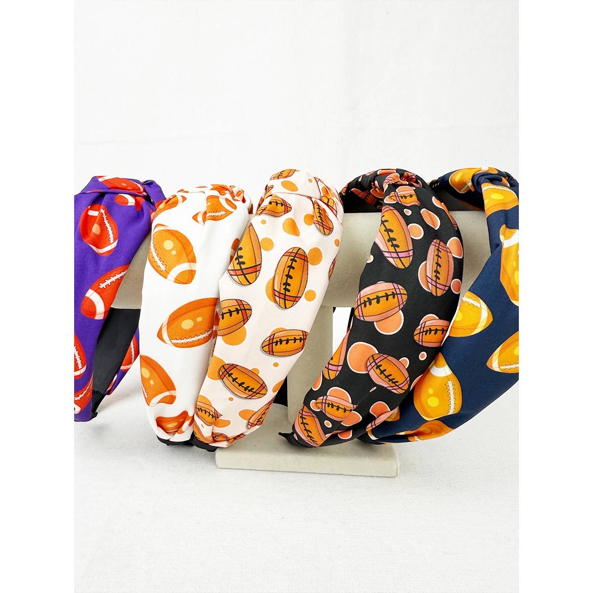 Set of colorful headbands with football pattern on a white background