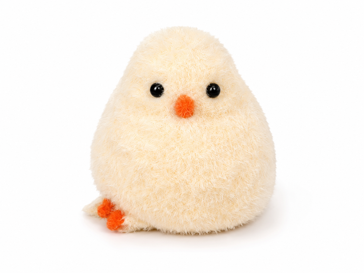 Small plush toy chick on a white background