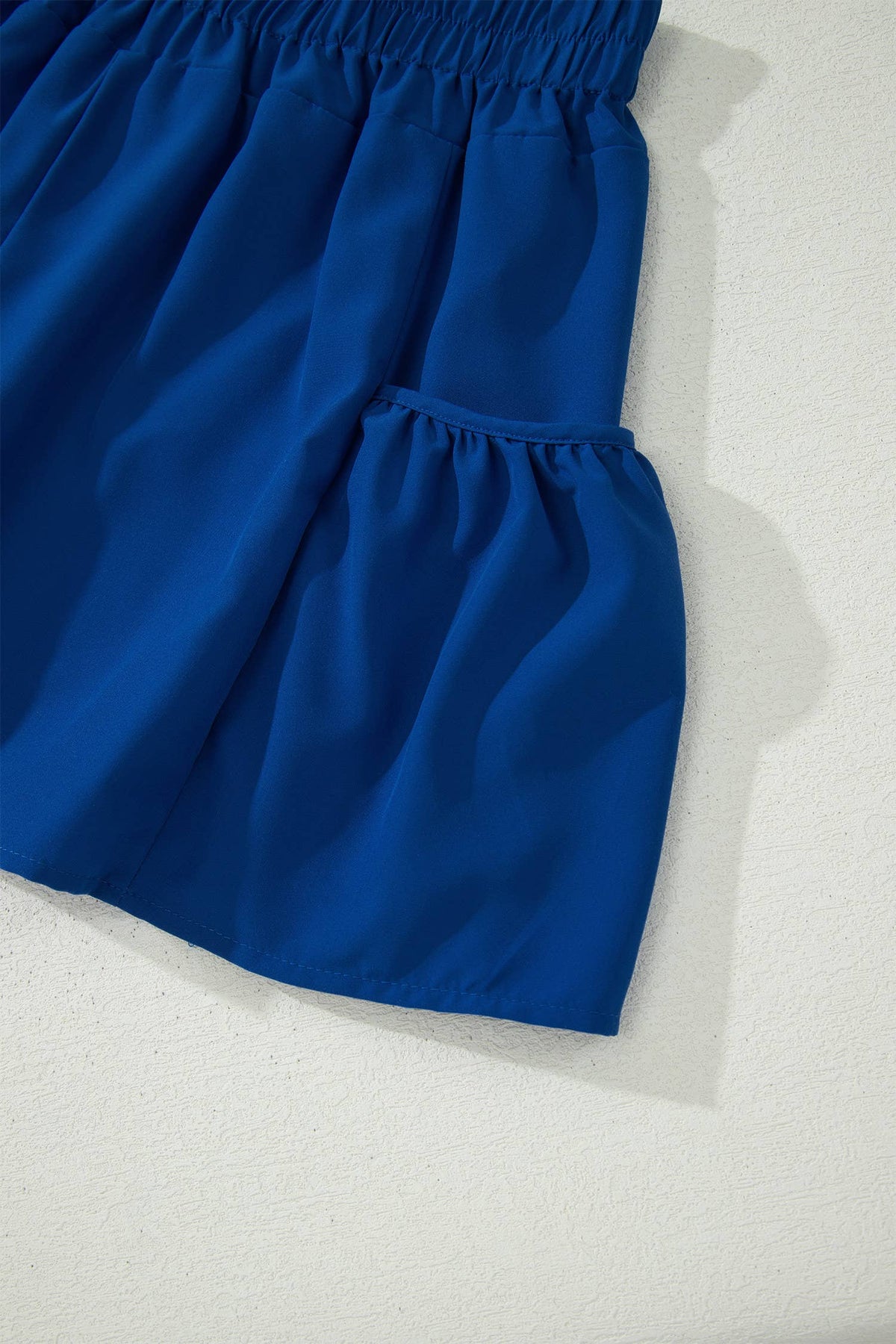 Blue shorts on a textured white background