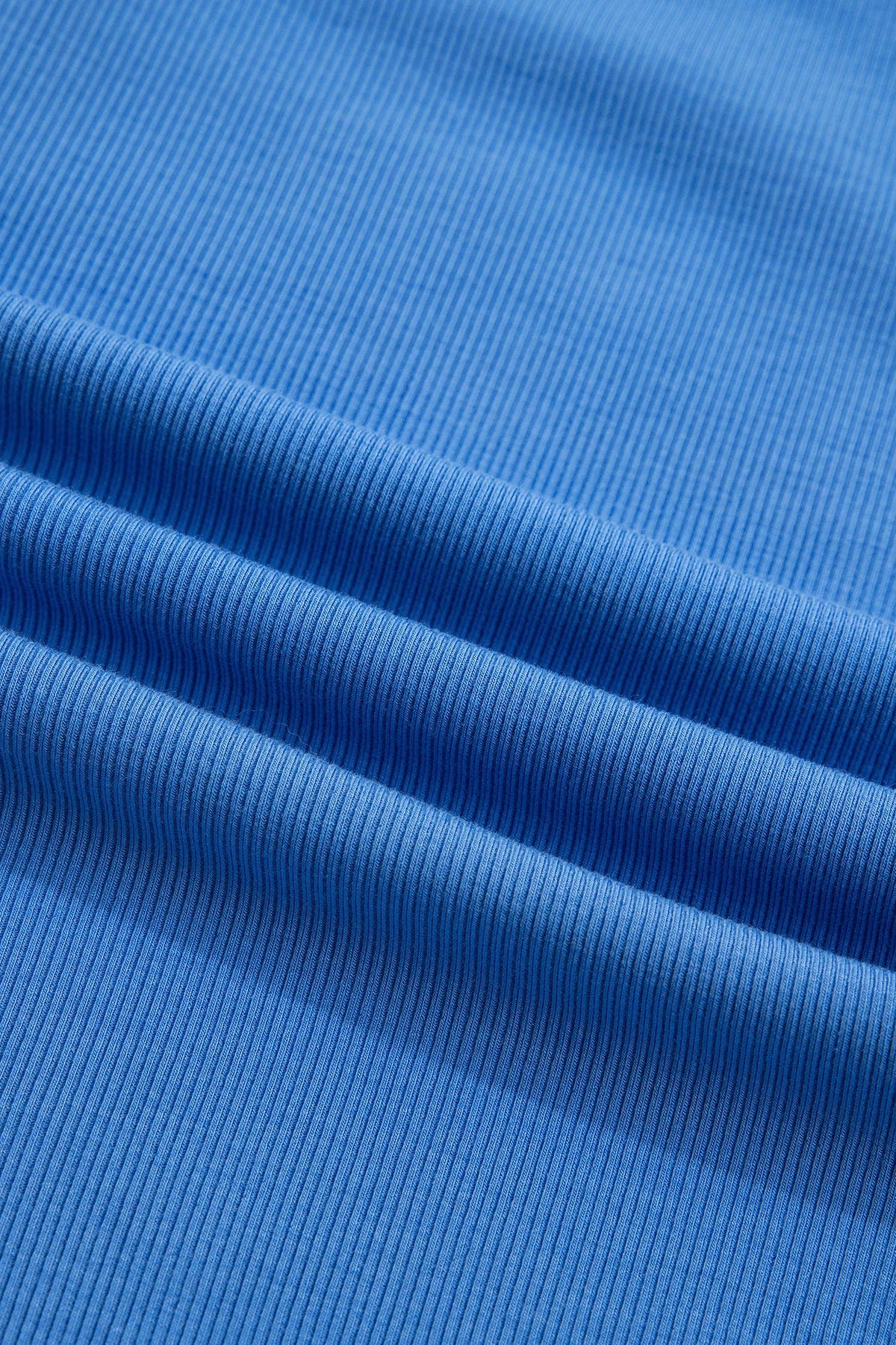 Close-up of blue ribbed fabric texture