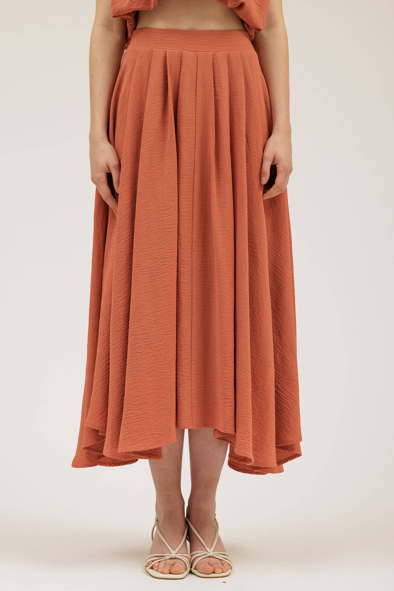 Person wearing the Wendy Skirt in Apricot.