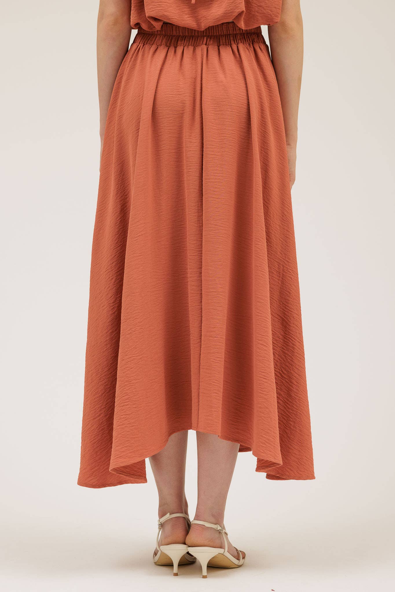 Person wearing the Wendy Skirt in Apricot.
