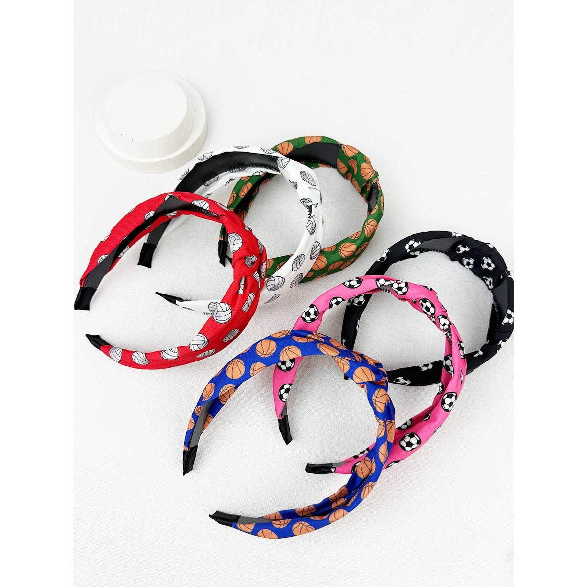 Set of colorful sports headbands with various patterns on a white background