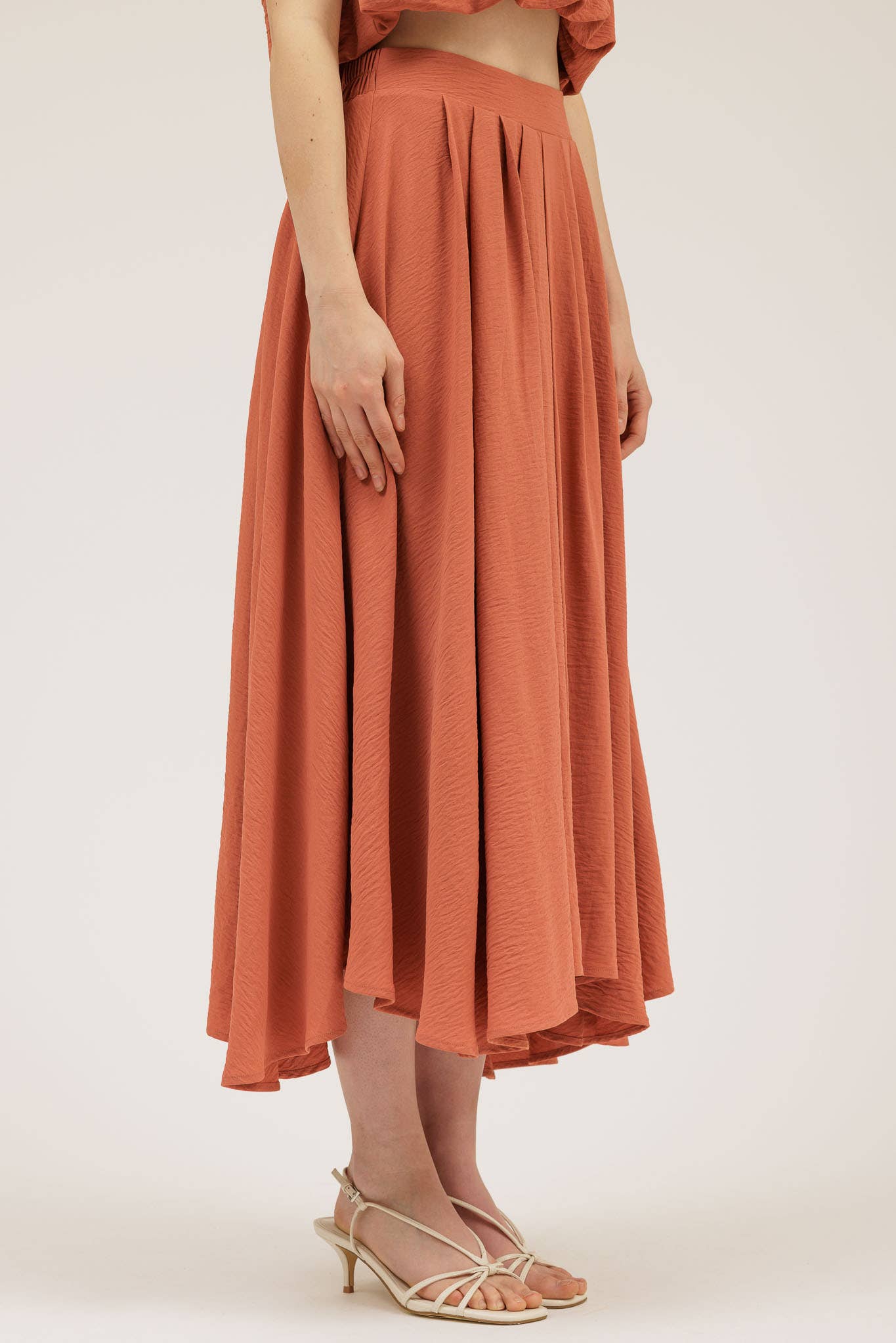 Person wearing the Wendy Skirt in Apricot.