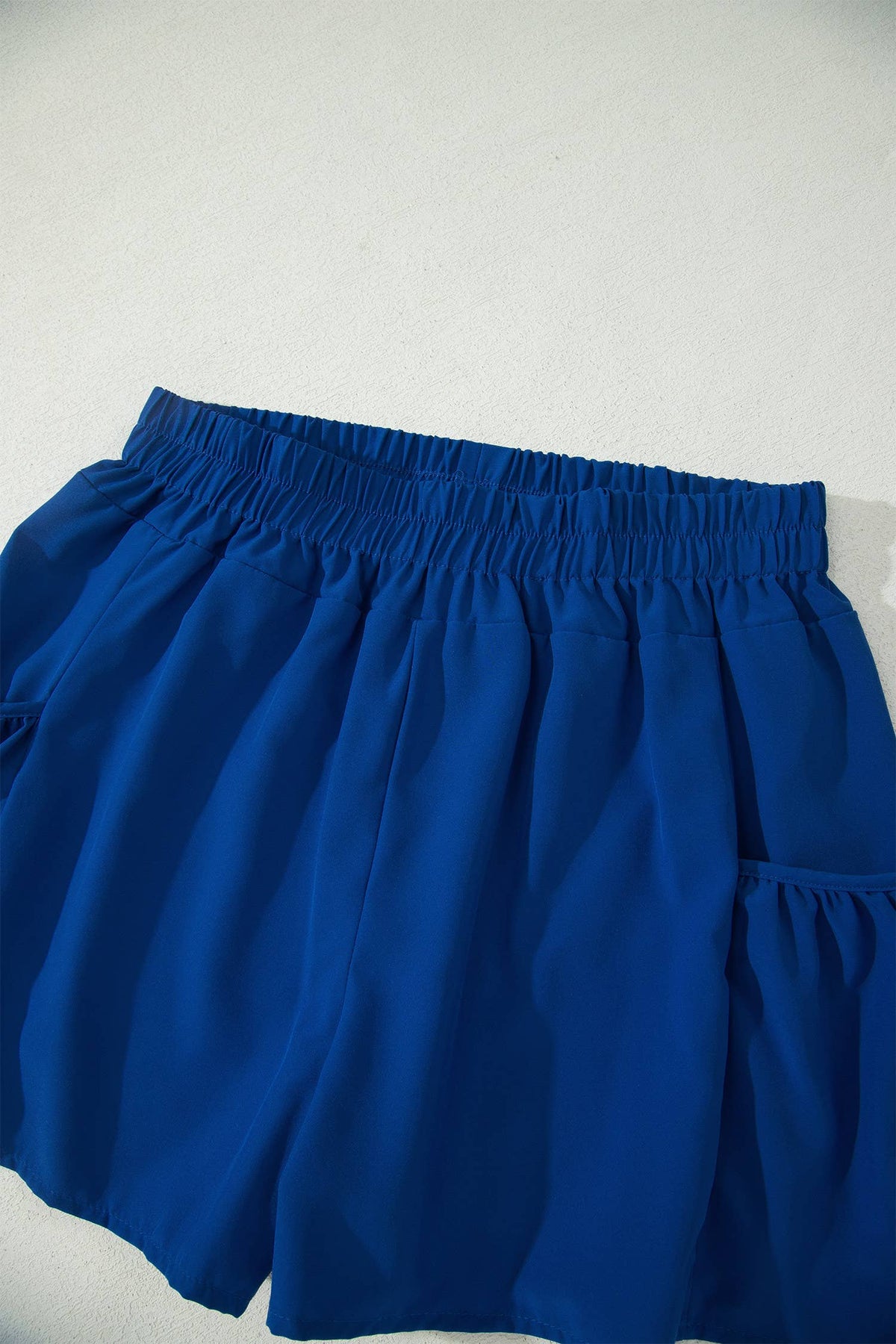 Blue shorts on a light gray background