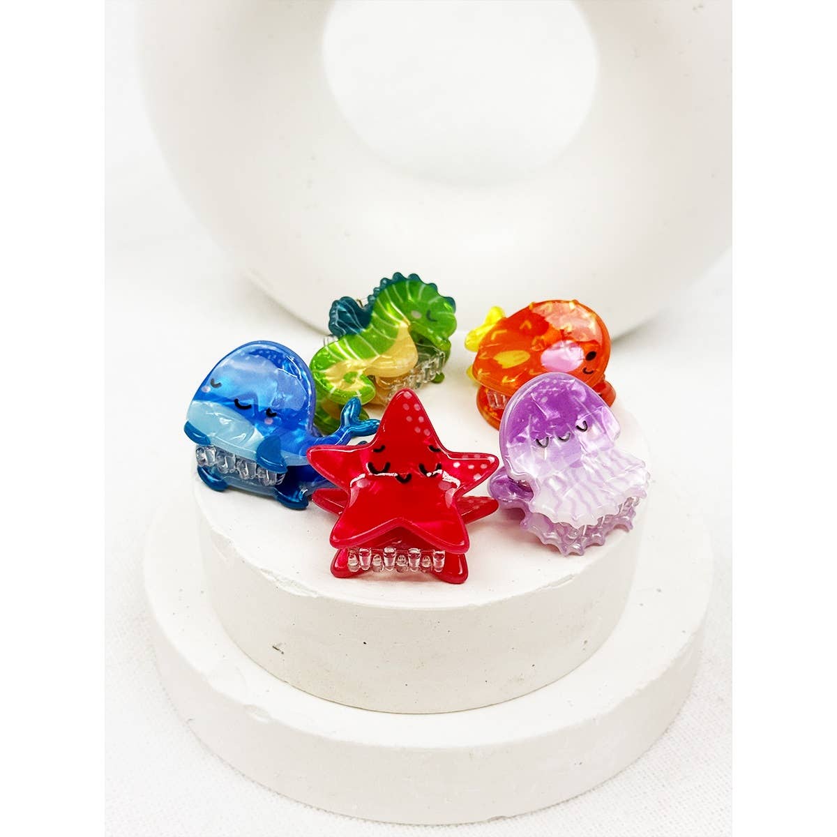 Colorful sea animal hair clips on a white background