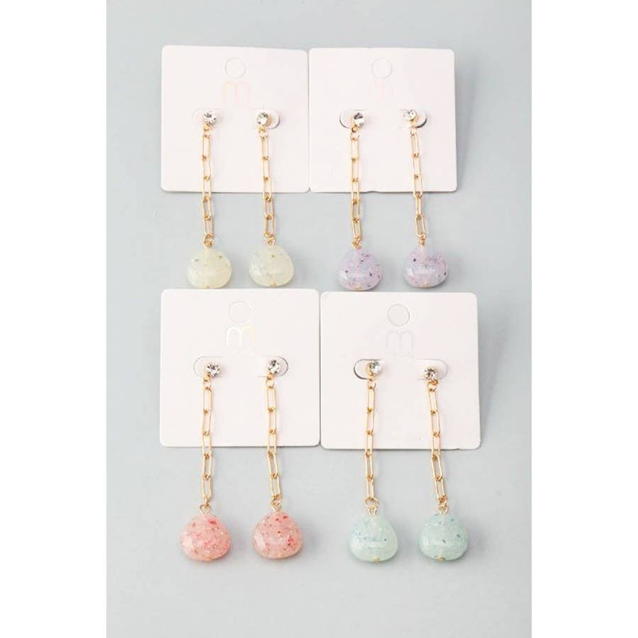 Set of earrings on a display card with a gray background