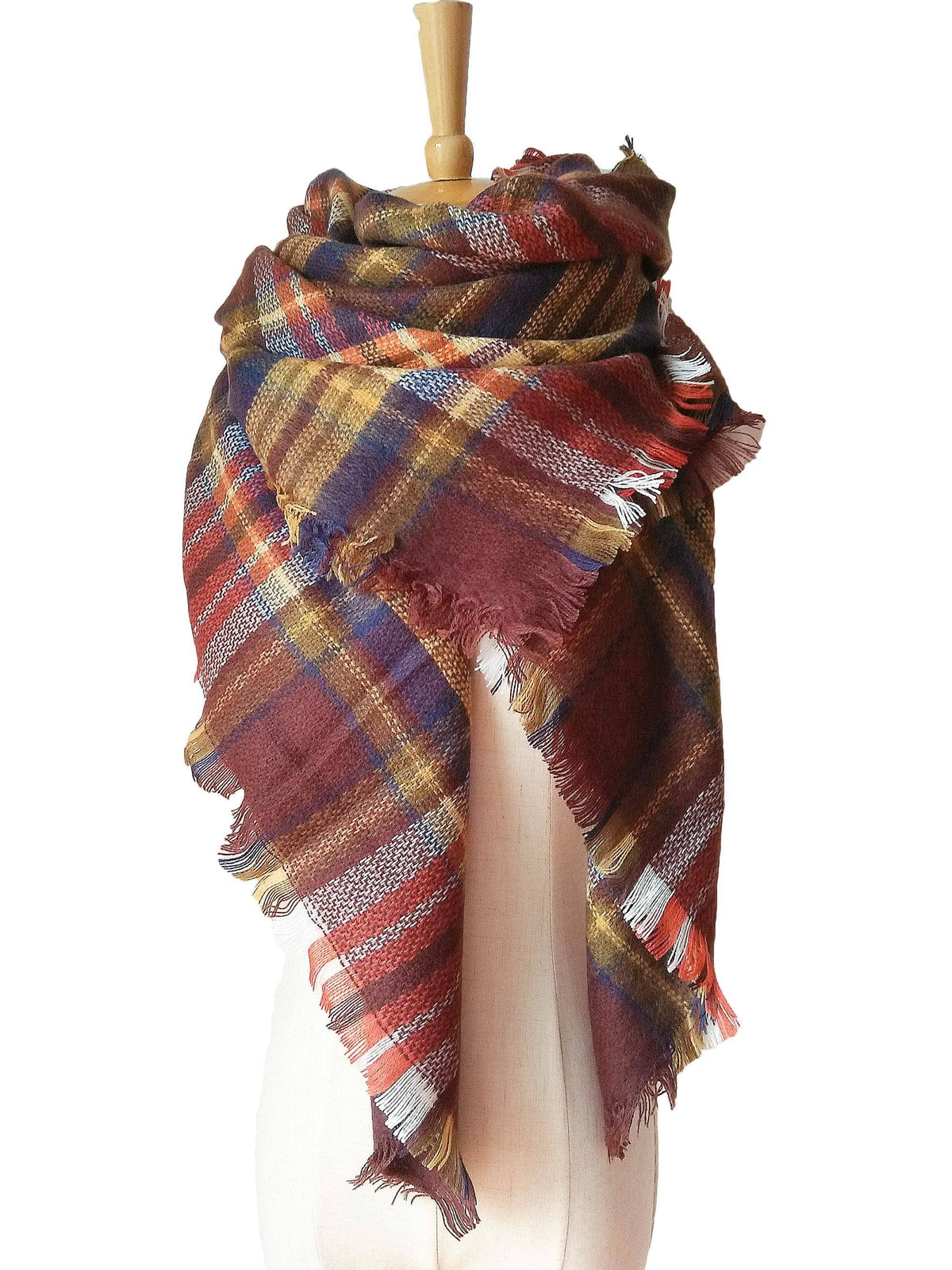 Plaid scarf in browns, yellows, blues, and oranges